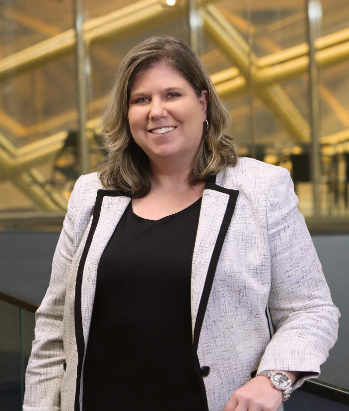 karen-volz Karen Volz in suit smiling.